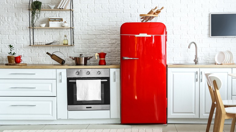 red fridge in white kitchen