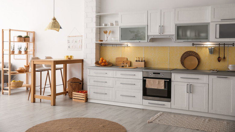 yellow backsplash in white kitchen
