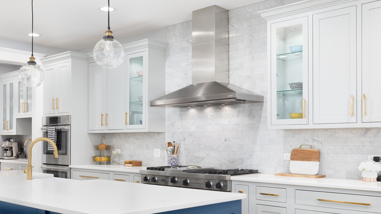 white glass-front kitchen cabinets