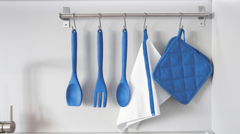 blue hanging kitchen utensils