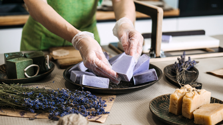 Someone making homemade lavender soap