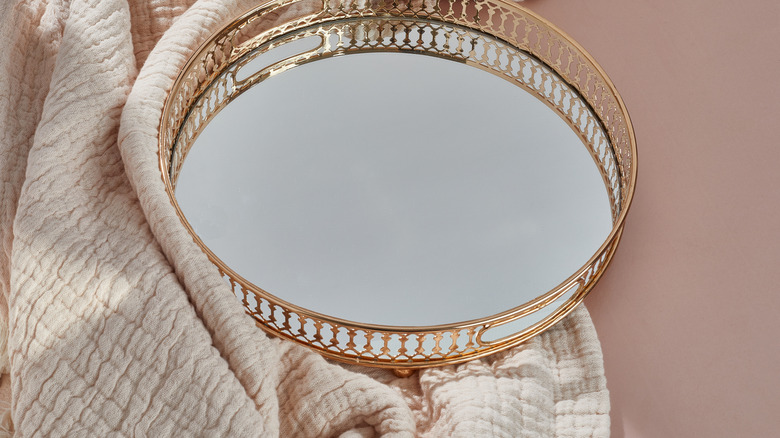 mirrored tray with towel