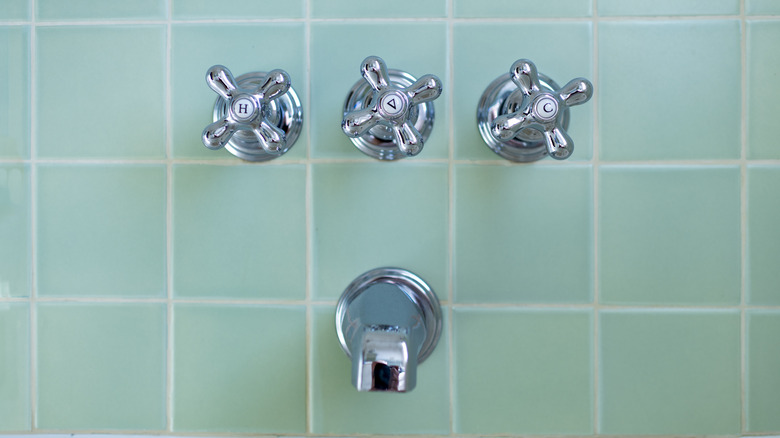 green pastel tiles and vintage fixtures