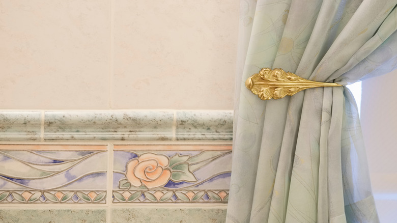 Shower curtain with brass tie-back hardware
