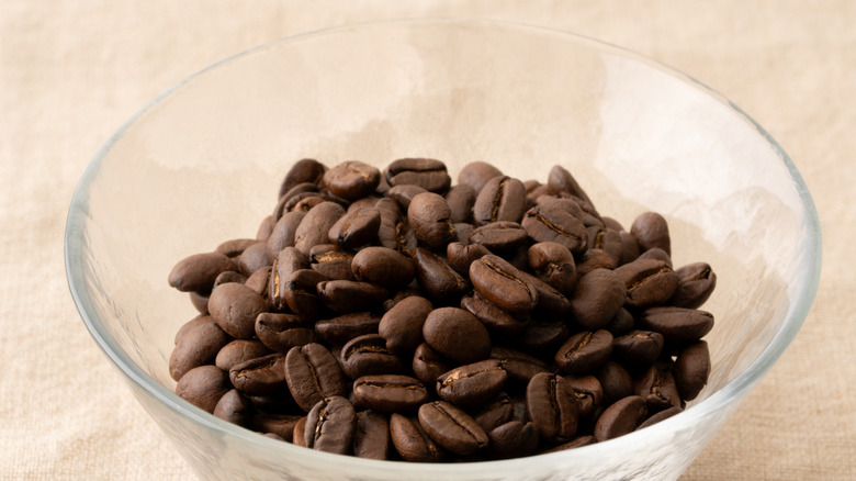 whole coffee beans in glass bowl