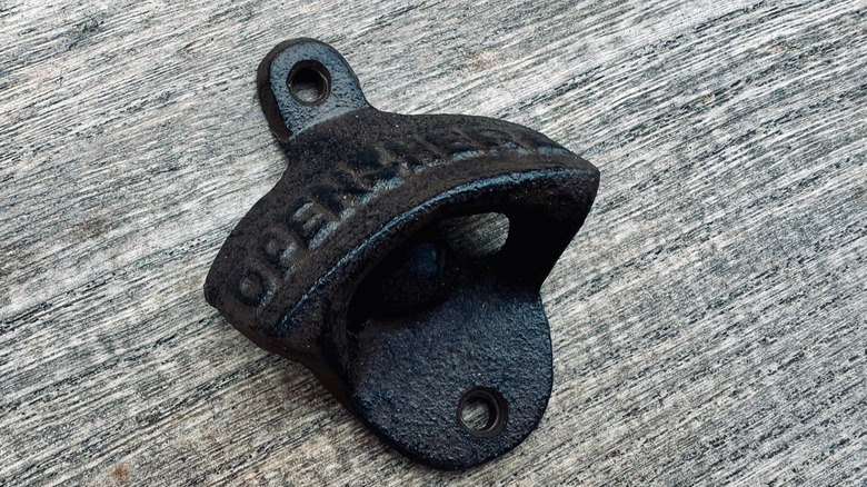 Wall mountable bottle opener made of cast iron