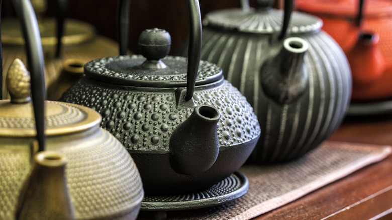 Decorative cast iron tea kettles, also known as tetsubins