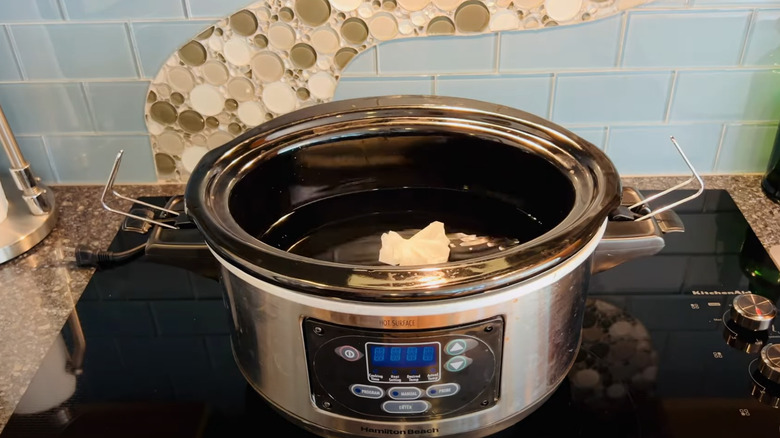 Coffee filter seasoning pack in crock pot.