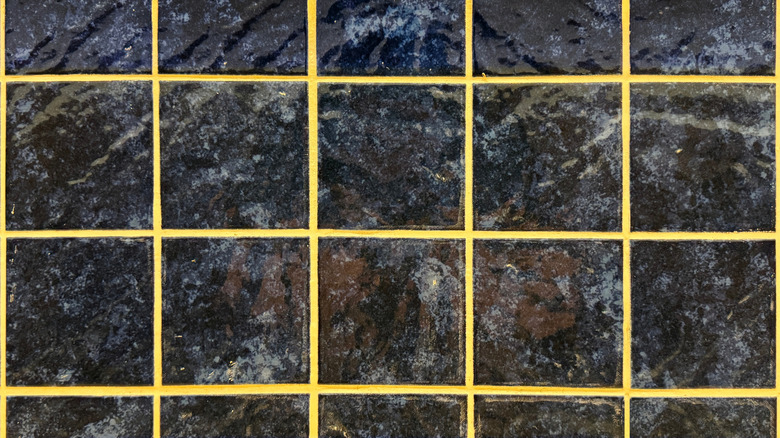 Black tiles with bright yellow grout