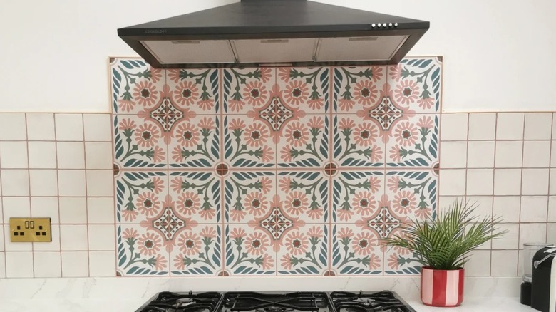 Kitchen with pink floral tiles and matching pink grout