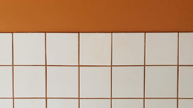 White tile with burnt orange grout