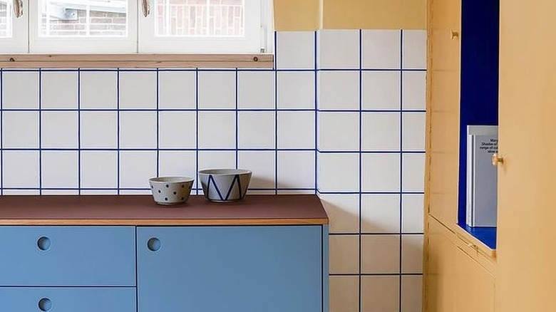 White backplash with blue grout