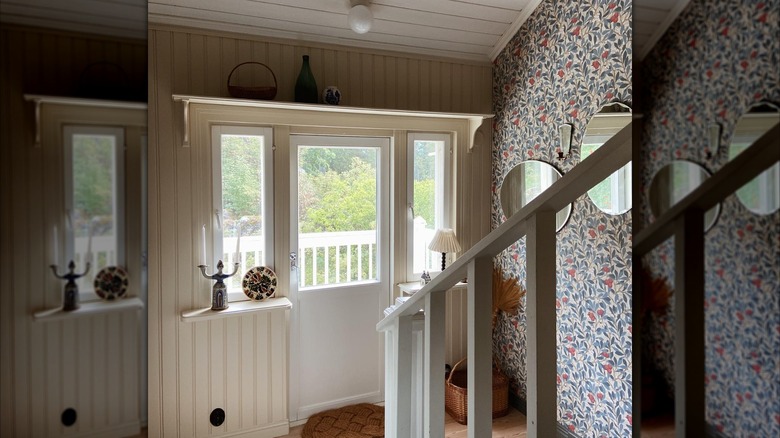 Wallpaper and accent wall on a staircase landing