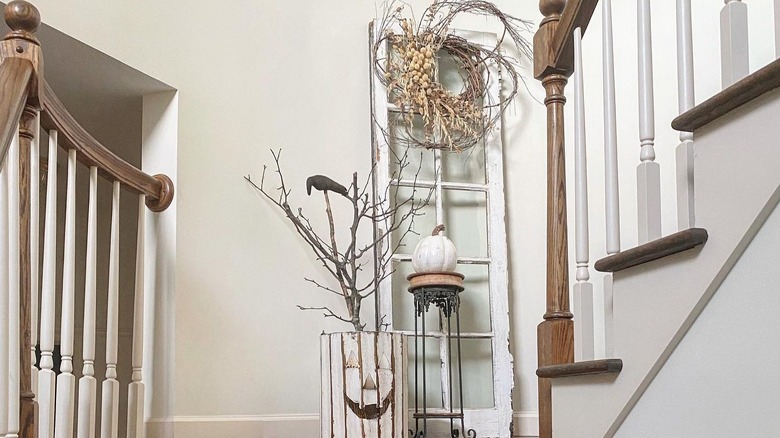 Fall-themed decoration on a staircase landing