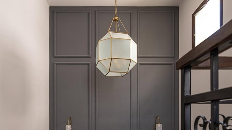 A beautiful pendant light hanging over a staircase landing