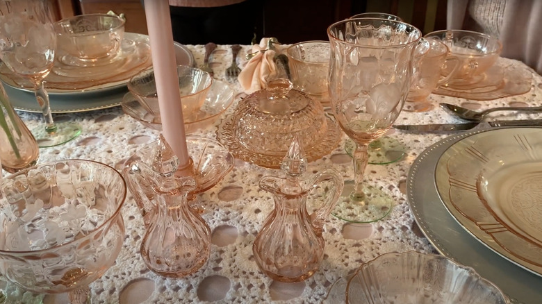 A table set with pink American Sweetheart patterned glassware made by Macbeth-Evans Glass Company