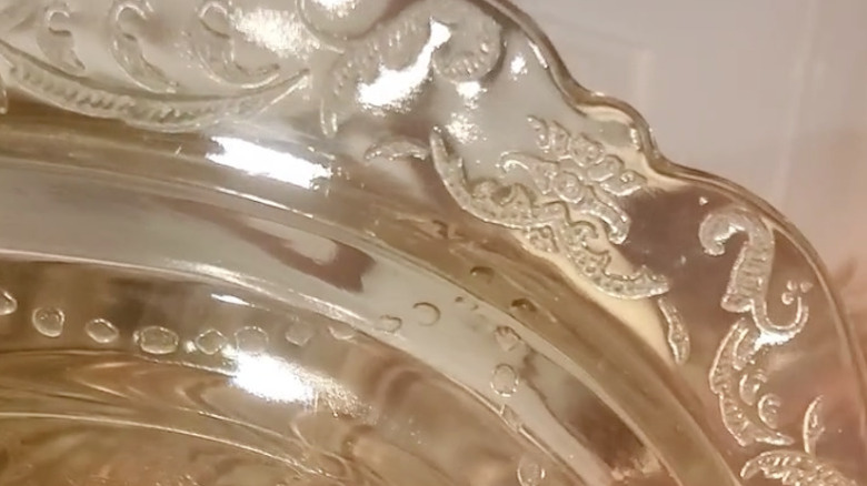 An up close view of an amber Madrid patterned plate by Federal Glass Company.