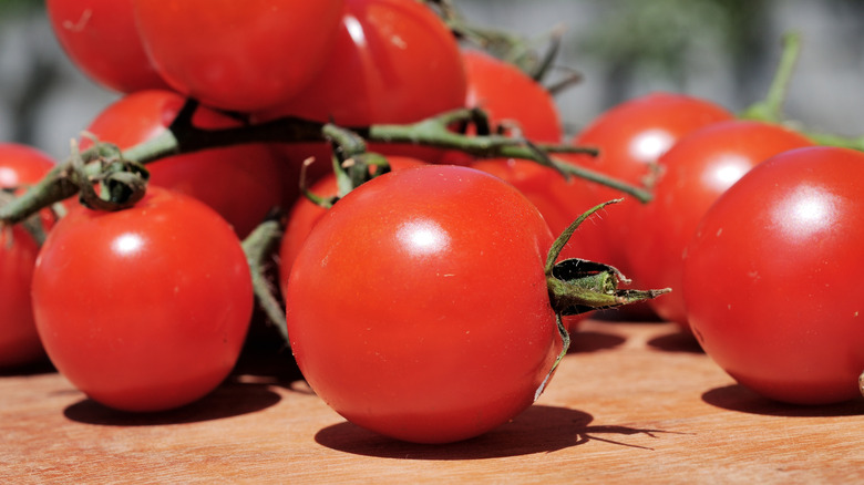 'Sweet Million' tomatoes on a wood surface in natural light