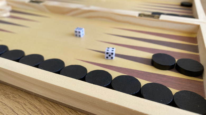 Backgammon board with game pieces