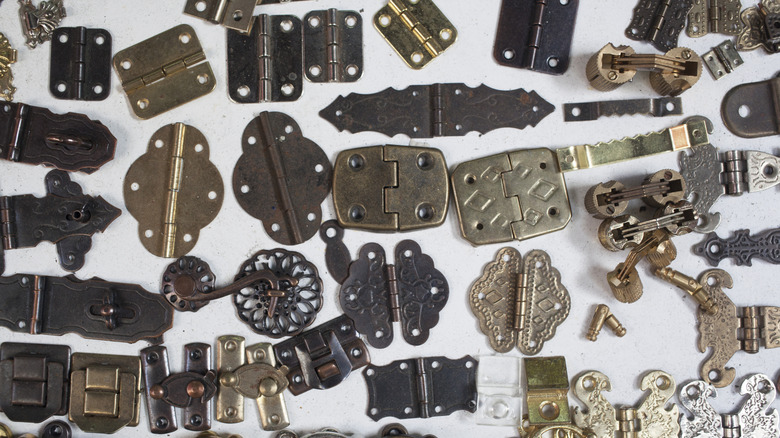 spread of vintage metal hinges
