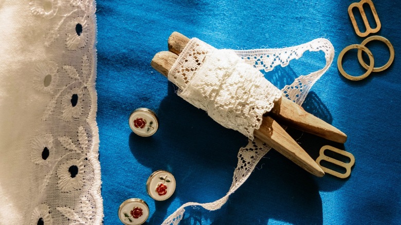 Vintage lace ribbon wrapped around clothespin