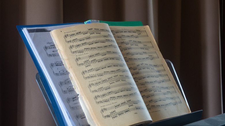 antique sheet music on stand