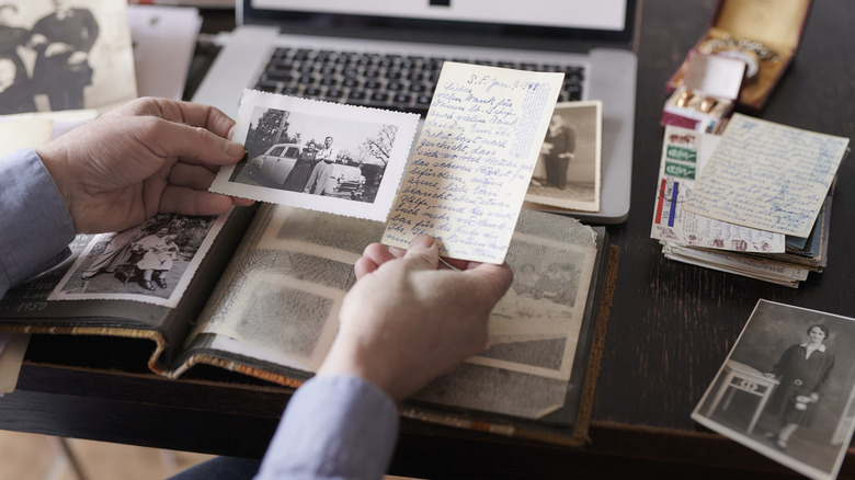 Person looking through vintage ephemera