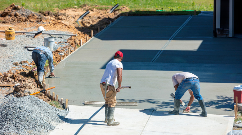 workers constructing a cement foundation