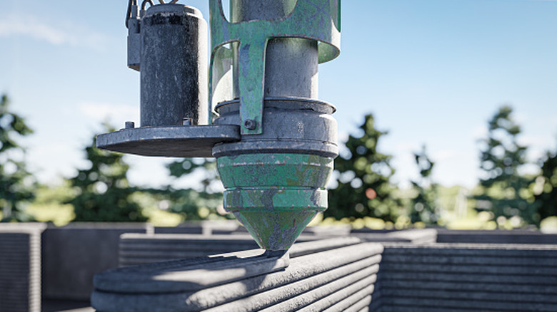 A concrete 3D printer building up a house