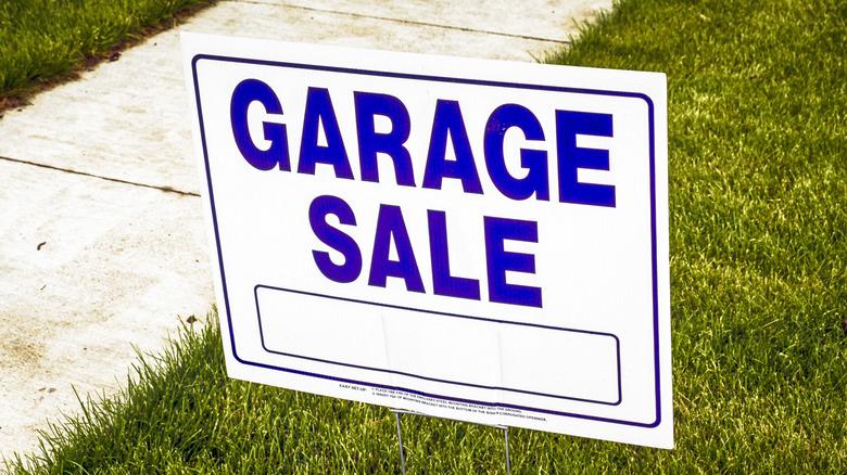 Garage sale sign on lawn