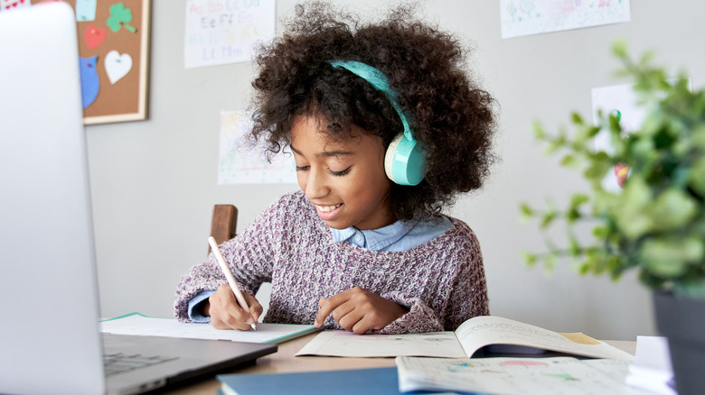 young girl working at desk