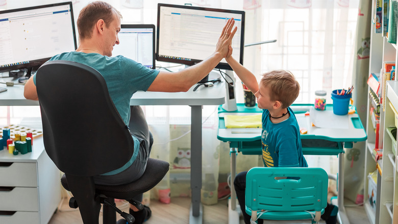 boy and father work together
