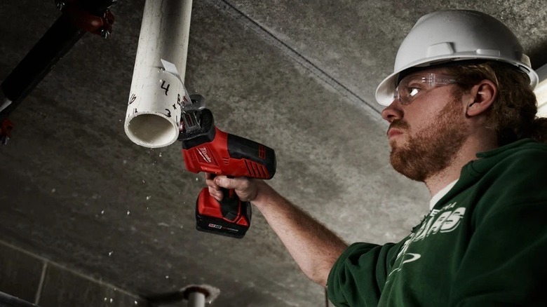 Man using a Hackzall on a pipe
