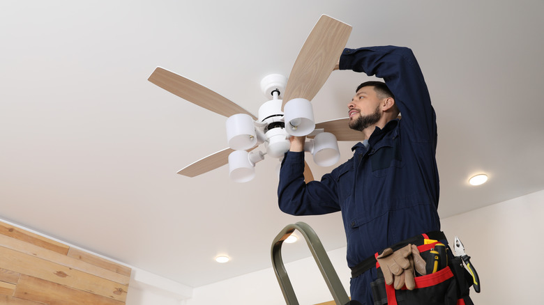 Man installing a ceiling fan