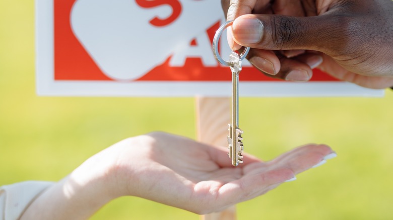 Hand with a house key