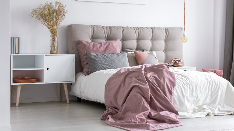 gray tufted bed