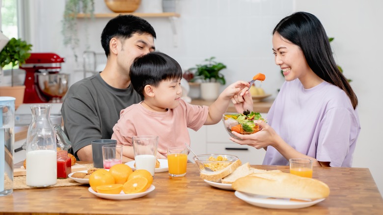 Family eating at dining table