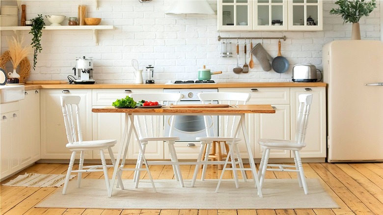 White kitchen with table 