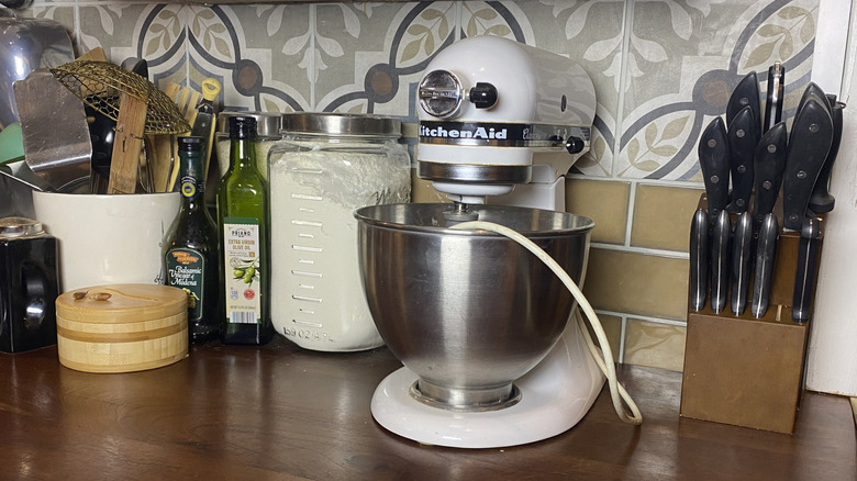 A thrifted knife block hiding a countertop outlet