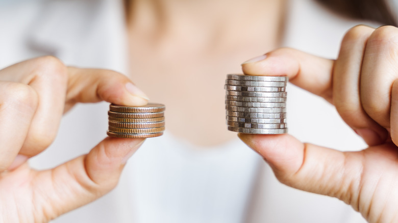 Hands holding coins
