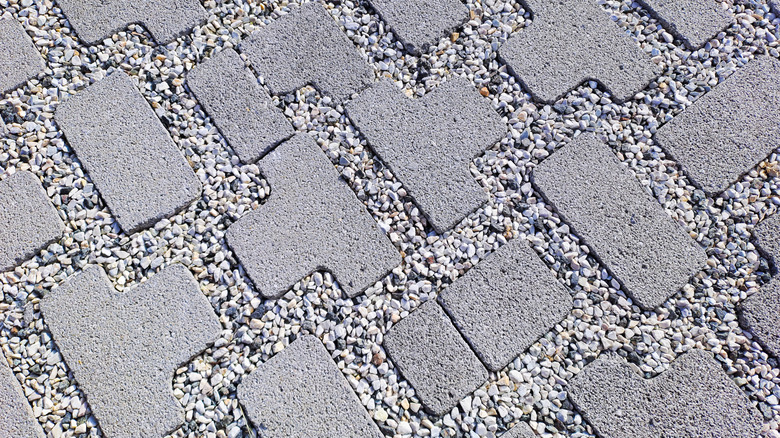 Permeable concrete pavers with gravel aggregate in a driveway