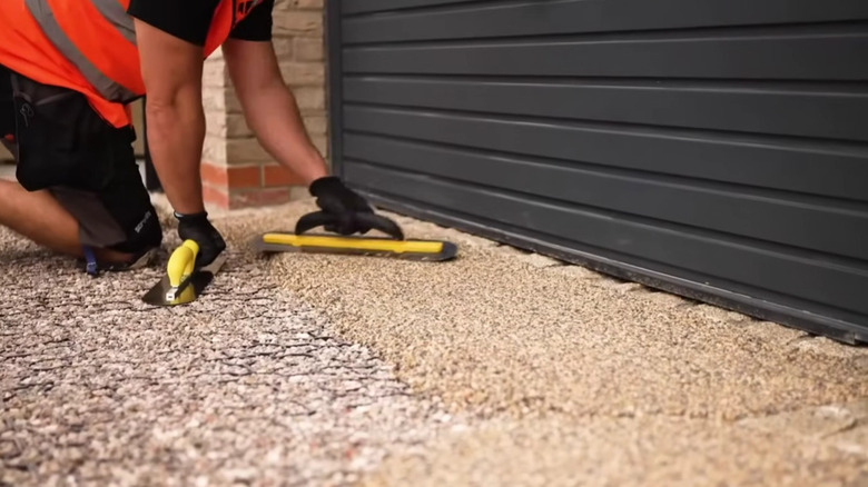Resin-bound gravel being installed on a driveway