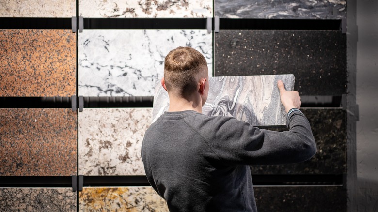 Man picking out tile