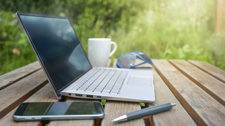 laptop on desk outside