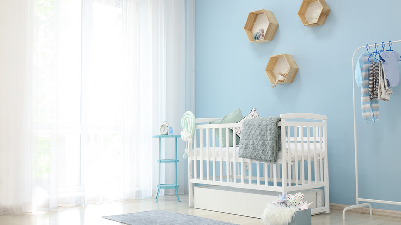 blue nursery with wicker shapes