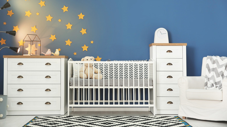 blue nursery with bold rug