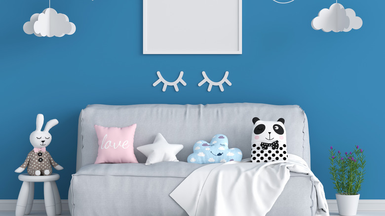 stuffed animals in blue nursery
