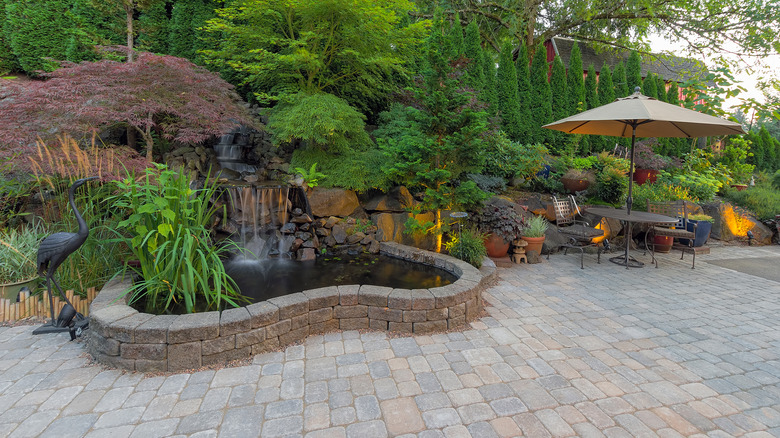 Fish pond on brick patio