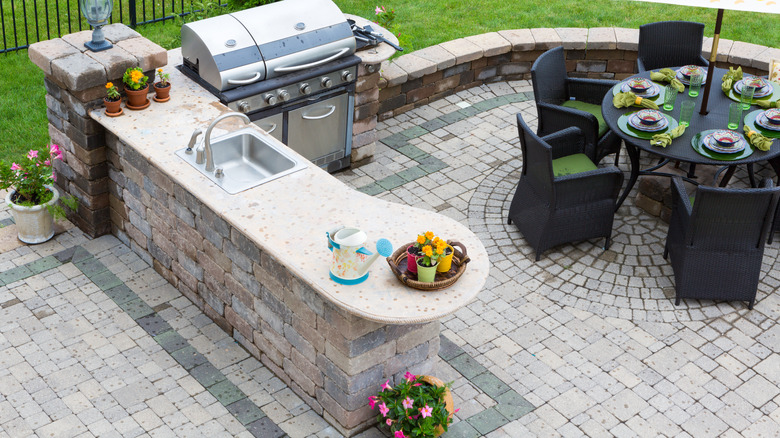 outdoor kitchen on brick patio