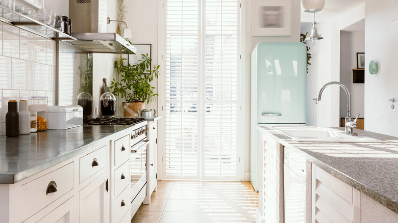 kitchen with turquoise fridge